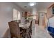 Dining area with wooden table and chairs, and kitchen view at 3728 Spiritual Way, Las Vegas, NV 89115