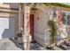 Red front door with decorative columns and landscaping at 3728 Spiritual Way, Las Vegas, NV 89115