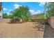 Spacious backyard with gravel and a mature tree at 3792 Nerine Pass Way Ave, North Las Vegas, NV 89031