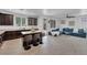 Modern kitchen with dark brown cabinets and a large island at 3792 Nerine Pass Way Ave, North Las Vegas, NV 89031