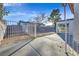 Backyard with concrete patio, grassy area, and gated enclosure at 3849 Boca Chica Ave, Las Vegas, NV 89120