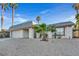 Single story home with a gravel yard and palm trees at 3849 Boca Chica Ave, Las Vegas, NV 89120