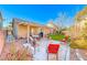 Spacious backyard with patio, grass, and seating area at 3918 Champagne Wood Dr, North Las Vegas, NV 89031