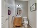 Simple bathroom with a toilet, sink and vanity at 3918 Champagne Wood Dr, North Las Vegas, NV 89031