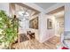 Bright and spacious entryway with wood-look tile floors and large artwork at 3918 Champagne Wood Dr, North Las Vegas, NV 89031