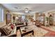 Open concept living room with a view into kitchen and dining area at 3918 Champagne Wood Dr, North Las Vegas, NV 89031