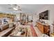 Open living area with hardwood floors, a view into the kitchen, and a fireplace at 3918 Champagne Wood Dr, North Las Vegas, NV 89031