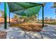 Shaded playground with play structure, and exercise equipment at 3918 Champagne Wood Dr, North Las Vegas, NV 89031