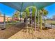 Modern playground equipment under a shaded structure at 3918 Champagne Wood Dr, North Las Vegas, NV 89031