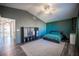 Spacious bedroom with ceiling fan, dark walls and ensuite bathroom at 4358 Raynham St, Las Vegas, NV 89115