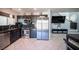 Modern kitchen with stainless steel appliances and dark cabinetry at 4358 Raynham St, Las Vegas, NV 89115