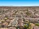 Wide aerial view of a suburban neighborhood with houses and streets at 4609 Snowpoint Ct, Las Vegas, NV 89130