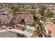 Aerial view of single-story house with tile roof, driveway, and landscaped yard at 4609 Snowpoint Ct, Las Vegas, NV 89130