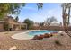 Inviting kidney-shaped pool with spacious decking at 4609 Snowpoint Ct, Las Vegas, NV 89130