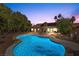 Stunning illuminated pool at dusk, perfect for relaxing at 4609 Snowpoint Ct, Las Vegas, NV 89130