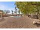 Relaxing pool area with large backyard and shade trees at 4609 Snowpoint Ct, Las Vegas, NV 89130