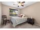 Cozy bedroom with ceiling fan and window at 4609 Snowpoint Ct, Las Vegas, NV 89130