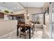 Cozy dining area with wood table and chairs near window at 4609 Snowpoint Ct, Las Vegas, NV 89130