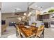 Kitchen features a spacious dining area with wood table and chairs at 4609 Snowpoint Ct, Las Vegas, NV 89130