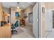 Home office with wood desk, teal chair, and built-in shelving at 4609 Snowpoint Ct, Las Vegas, NV 89130