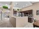 Open kitchen with breakfast bar and view into living room at 4609 Snowpoint Ct, Las Vegas, NV 89130