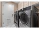 Laundry room with washer, dryer, and cabinets at 4609 Snowpoint Ct, Las Vegas, NV 89130