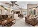 Open living room with view of kitchen and dining area at 4609 Snowpoint Ct, Las Vegas, NV 89130