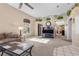 Bright living room with high ceilings, L-shaped sectional sofa, and built-in shelving at 4609 Snowpoint Ct, Las Vegas, NV 89130