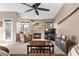 Spacious living room with fireplace and ceiling fan at 4609 Snowpoint Ct, Las Vegas, NV 89130