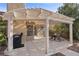 Covered patio perfect for outdoor dining and grilling at 4609 Snowpoint Ct, Las Vegas, NV 89130