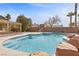 Stunning kidney-shaped pool with ample patio space at 4609 Snowpoint Ct, Las Vegas, NV 89130