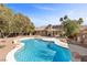 Inviting kidney-shaped pool with large patio area at 4609 Snowpoint Ct, Las Vegas, NV 89130