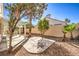 Backyard with pergola, patio, and mature trees at 4861 Camino Sombrero, North Las Vegas, NV 89031