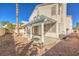 Backyard with pergola, patio, and gravel landscaping at 4861 Camino Sombrero, North Las Vegas, NV 89031