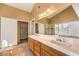 Bathroom boasts double sinks, wood cabinets, and a shower at 4861 Camino Sombrero, North Las Vegas, NV 89031