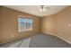 Sunny bedroom with gray carpet and window view at 4861 Camino Sombrero, North Las Vegas, NV 89031