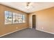 Bright bedroom with large window and ceiling fan at 4861 Camino Sombrero, North Las Vegas, NV 89031