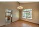 Dining room with kitchen view and chandelier at 4861 Camino Sombrero, North Las Vegas, NV 89031