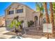 Two-story house with a three-car garage and front landscaping at 4861 Camino Sombrero, North Las Vegas, NV 89031