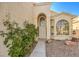 Front entrance with arched entryway and landscaping at 4861 Camino Sombrero, North Las Vegas, NV 89031