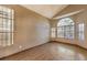 Living room with hardwood floors and large windows at 4861 Camino Sombrero, North Las Vegas, NV 89031