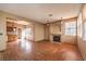 Open living area with fireplace and hardwood floors at 4861 Camino Sombrero, North Las Vegas, NV 89031