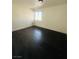 Bright bedroom with dark hardwood floors and window at 4981 Alondra Dr, Las Vegas, NV 89118