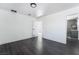 Bedroom with neutral paint, dark laminate floors, and an ensuite bathroom at 4981 Alondra Dr, Las Vegas, NV 89118