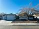 Single-story house with attached garage and landscaping at 4981 Alondra Dr, Las Vegas, NV 89118