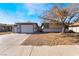 Charming single-story home featuring a two-car garage, neutral paint, and a well-maintained front yard at 4981 Alondra Dr, Las Vegas, NV 89118