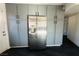 Gray kitchen cabinets and stainless steel refrigerator at 4981 Alondra Dr, Las Vegas, NV 89118