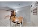 Charming dining area with wood table and white chairs at 5124 Brownwood Ave, Las Vegas, NV 89122