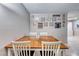 Dining area with wood table and chairs, adjacent to living room at 5124 Brownwood Ave, Las Vegas, NV 89122