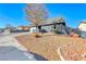 Landscaped front yard with gravel and a tree at 5124 Brownwood Ave, Las Vegas, NV 89122